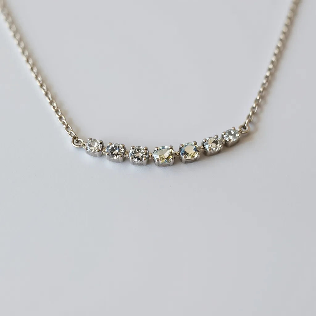 Moissanite tennis chain necklace with evenly set faceted stones and bright sparkle on a clean studio background