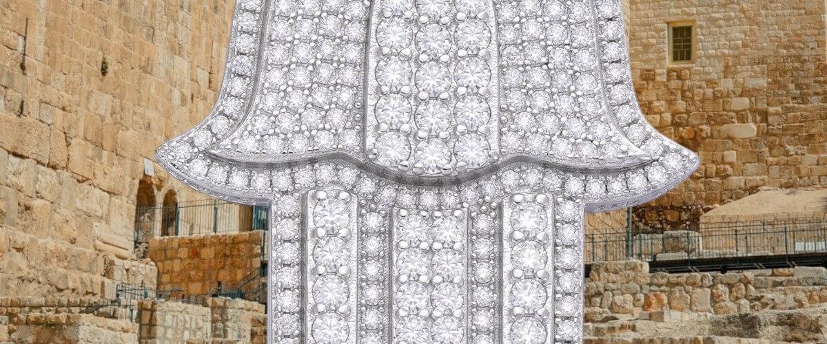 Diamond-encrusted necklace against a stone wall background
